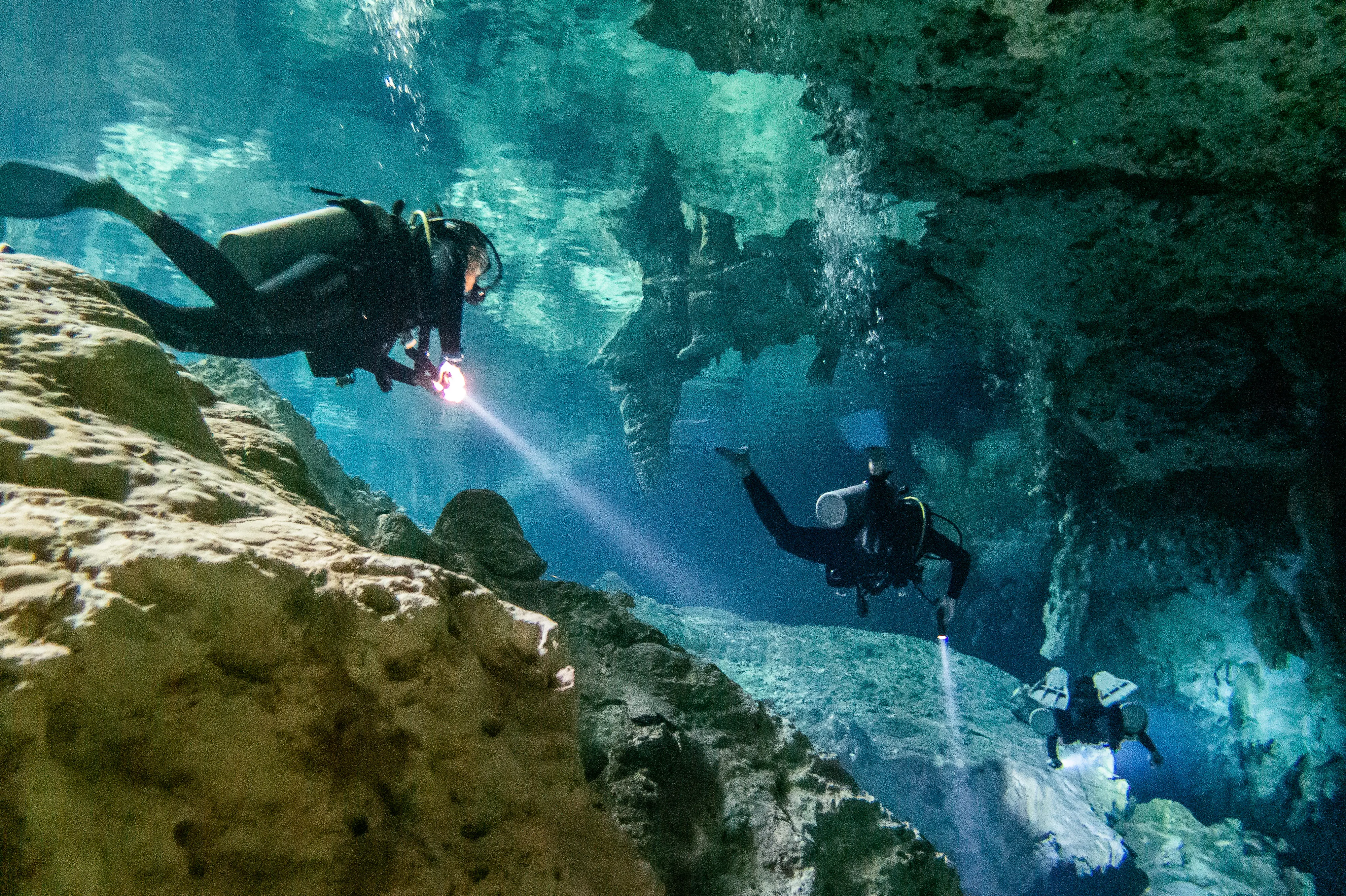 Cavern divers in Dos Ojos Cenote